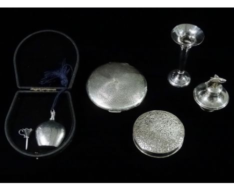 A silver compact, Chester 1934, diameter 9cm, a filled silver epergne, height 9cm, a white metal scent bottle and funnel, a w