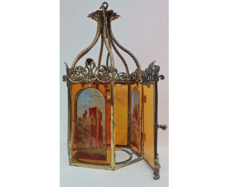 A Victorian style brass framed hall lantern, fitted amber glass panels, three painted with rural buildings, height 55cm. 