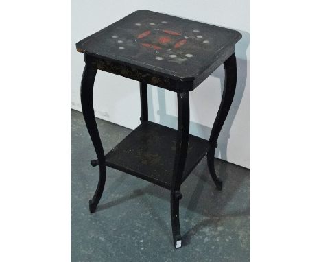 A small Japanese lacquered occasional table with floral decoration to the top and lower shelf.