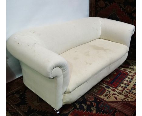 A late 19th/early 20th century two seater Chesterfield sofa on turned front legs, height 70cm, width 180cm.