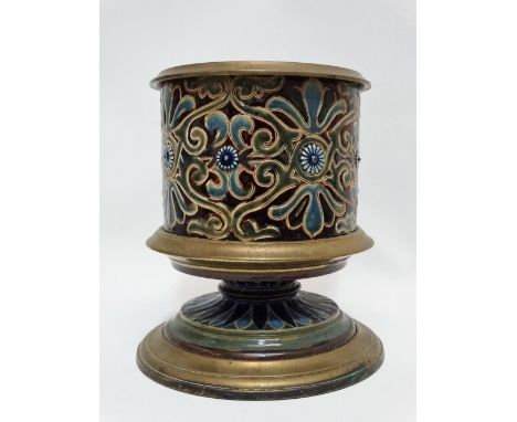 A 19th century Doulton stoneware and brass oil lamp base, decorated with scrolling designs and flower bosses, height 20cm.