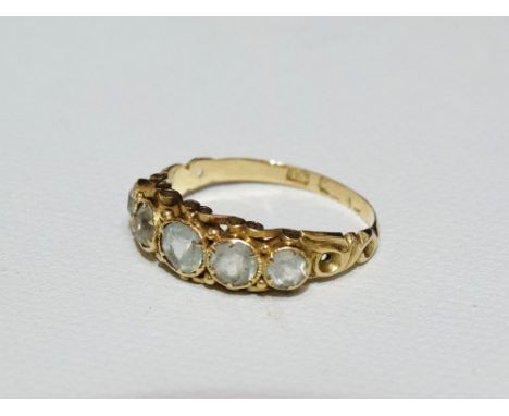 A 15ct gold ring set five graduated white sapphires, size N.