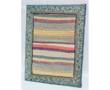 A late 19th/early 20th century Chinese silk embroidered panel, the blue border decorated with butterflies, birds and flowers,