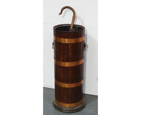 An oak and copper bound circular umbrella stand with original zinc liner, height 78cm, together with a shooting stick. 