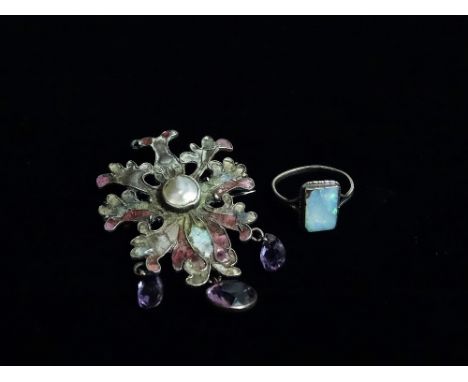 An Arts and Crafts silver and enamel brooch set a natural pearl with three amethyst drops, together with a silver ring set an