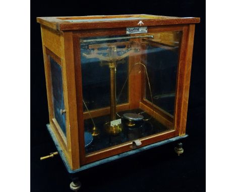 A L. Oertling Model 48 laboratory balance scales in fitted mahogany case with broad arrow mark, height 42cm.