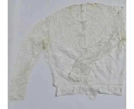 An Edwardian child's white lace blouse, length 47cm.