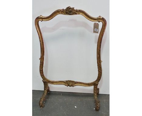 A 19th century carved and giltwood firescreen frame in Rococo taste, height 102cm.