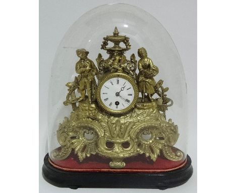 A continental gilt metal mantle clock, the 7.5cm white enamel dial with Roman numeral chapter ring, with ebonised stand and g