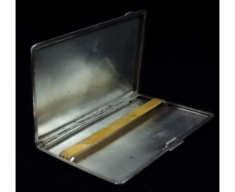 A silver engine turned cigarette case, with engraved monogram A.H.S., Birmingham 1945, weight 6.3oz approximately.