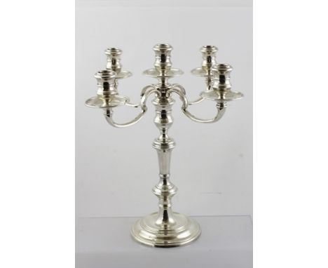 R** G** A GEORGIAN STYLE SILVER FIVE-LIGHT FOUR-BRANCH CANDELABRUM, having turned integral sconces and drip pans, ringed stem