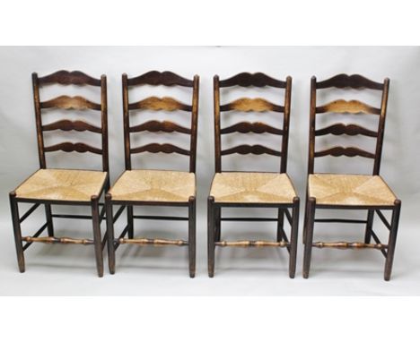 A SET OF FOUR EARLY 20TH CENTURY LADDER BACK PROVINCIAL SINGLE CHAIRS having woven seagrass seats and turned front stretchers