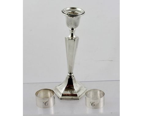 AN EARLY 20TH CENTURY SILVER CANDLESTICK of Georgian design, having tapering stem on hexagonal base, considered to be Birming