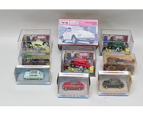 A POLSTIL CLUB MODEL VW 1300L in original vending box, Dinky Toys three die-cast models of VW Beetles in original vending box