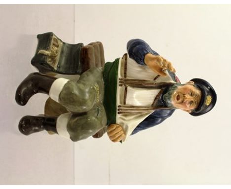 A ROYAL DOULTON EARTHENWARE MODEL "TALL STORY", an old fisherman seated holding a pond yacht, HN2248, 16cm high 