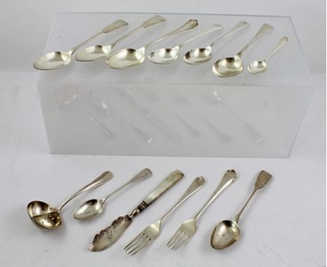 AN ASSORTMENT OF SILVER FLATWARE, nine assorted spoons, "Rattail" ladle, two forks and mother-of-pearl handled butter knife, 