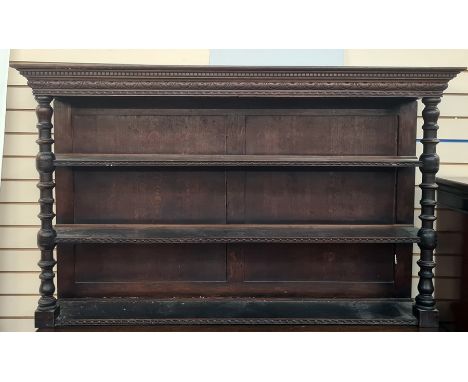 Victorian carved oak three-tier platerack having carved lunette frieze, on bulbous ring turned supports, 163cm wide  
