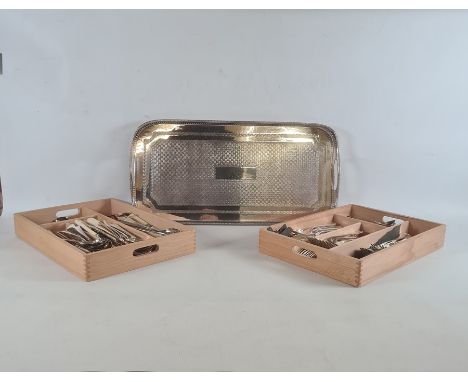 Rectangular two-handled tray with pierced rim and a quantity of silver plated flatware 