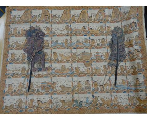 Japanese painted fabric panel with various figures, deities and animals with script, together with a pair of eastern stick pu