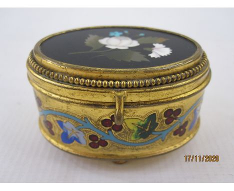 Late 19th century Italian gilt metal jewellery box of oval form, the hinged cover inset with a pietra dura panel of flowers a