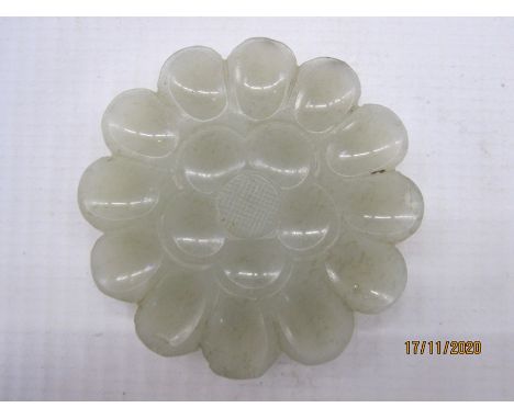 Chinese carved jade plaque, pale celadon, in the form of a flowerhead with concave petals and cross-hatched centre, 4cm diame