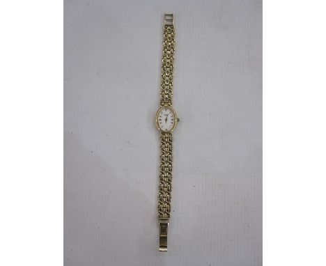 Modern lady's 9ct gold Rotary bracelet watch, the oval dial with baton markers and integral 9ct gold fancy-link bracelet, 20.