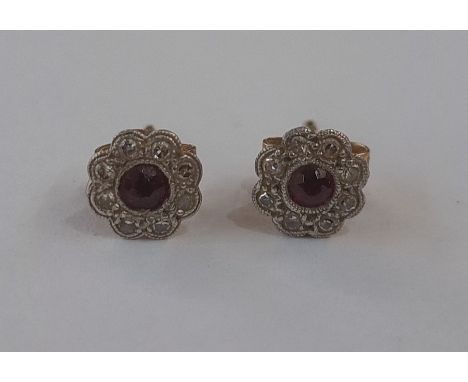Pair ruby and diamond flower cluster stud earrings set central ruby (worn) and small diamonds 