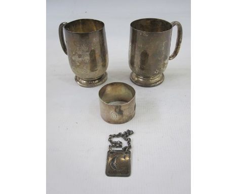 A 1930s silver christening mug, initialled 'A', London 1930, makers mark worn, 2.8toz, 8.7cm high, another similar christenin