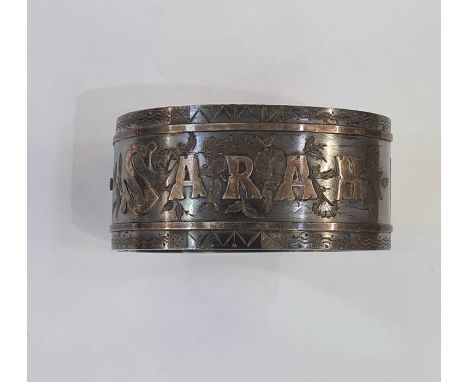 Victorian silver hinged bangle inscribed 'Sarah' with engraved decoration, 1.12toz