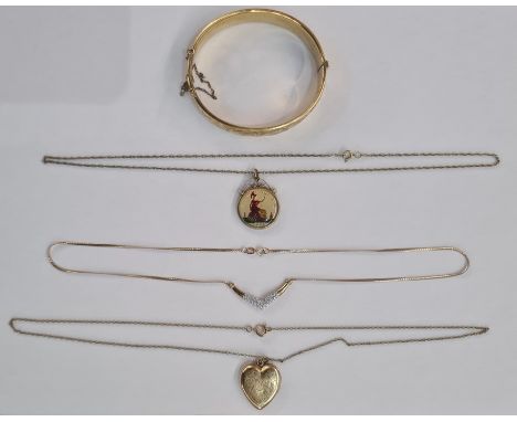 9ct gold and cubic zirconium necklace, chevron design on an integral black curb link chain, gold plated locket on chain, gold