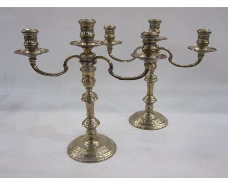 Pair of late 20th century silver-mounted three-branch candelabra on circular turned bases, London 1970, maker William Comyns 