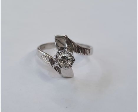 18ct white gold and diamond solitaire ring in twist setting, the single diamond approx. .25 in illusion setting