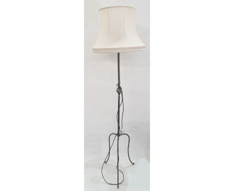 20th century wrought iron standard lamp on three cabriole supports, cream shade