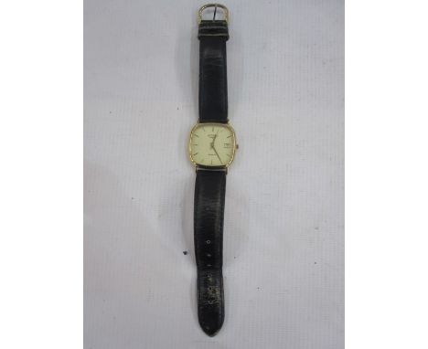 Gentleman's 9ct gold Rotary strap watch, the shaped square dial with baton markers and date aperture and on a leather strap