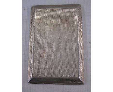 A 1920s silver cigarette case, rectangular, engine turned decoration, inscribed to the inside ' Presented to K.W.F.Talbot by 