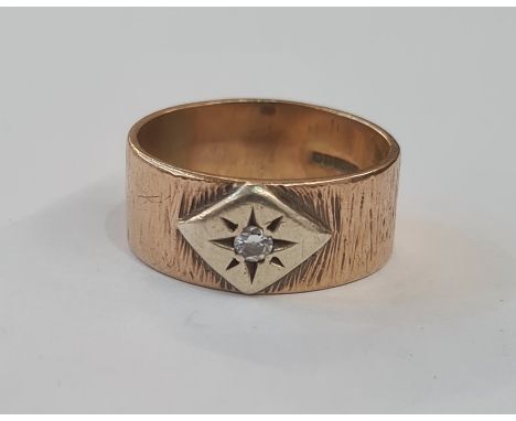 9ct gold and diamond ring, the bark finish band set with single diamond in lozenge surround, 9g approx total