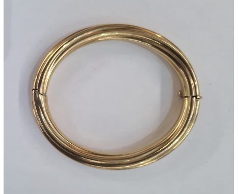 Gold hinged bangle&nbsp;marked 9k of twisted rib design, approx. 25.5g