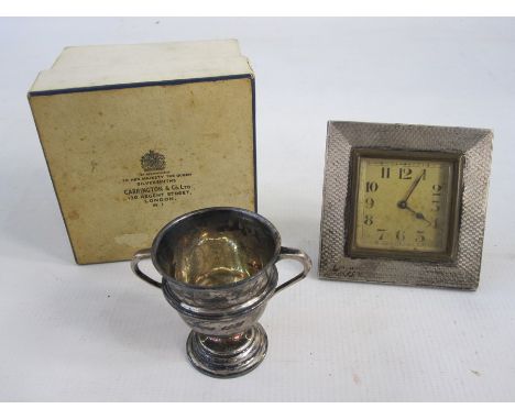 A 1920s silver mounted square framed alarm clock, Arabic numerals to the dial, engine turned decoration to frame, 7.5cm wide 