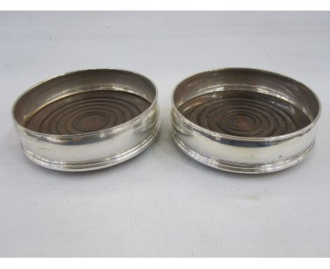 Pair of late 20th century silver-mounted and turned wood wine coasters, slightly bulbous, London, maker David R Mills (2)  Co