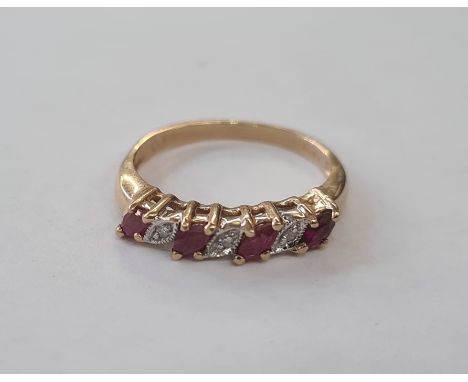 9ct gold, ruby and diamond ring set four elliptical rubies interpersed by three small diamonds 