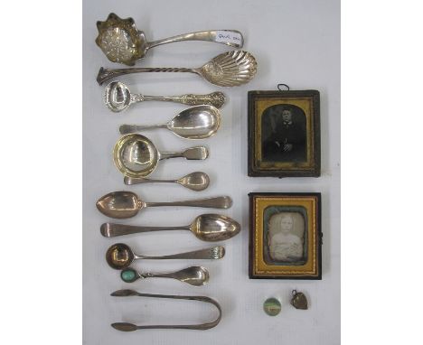 An early 19th Century silver caddy spoon, initialled to handle G.R.B, London 1815, makers mark worn, 0.53toz, a small gold co