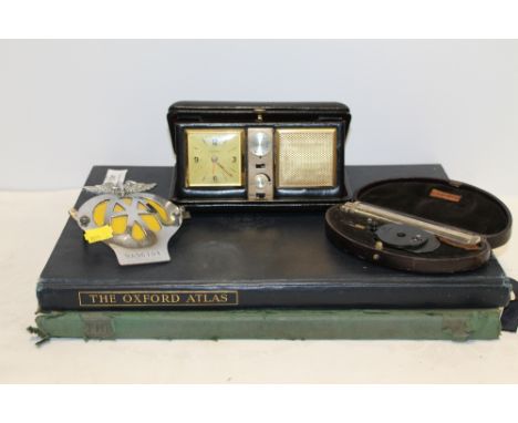 A CLIFFORD BROWN OPHTHALMOSCOPE TOGETHER A ESTYMA TRAVELLING RADIO ALARM CLOCK, VINTAGE AA BADGE, AND TWO ATLASES