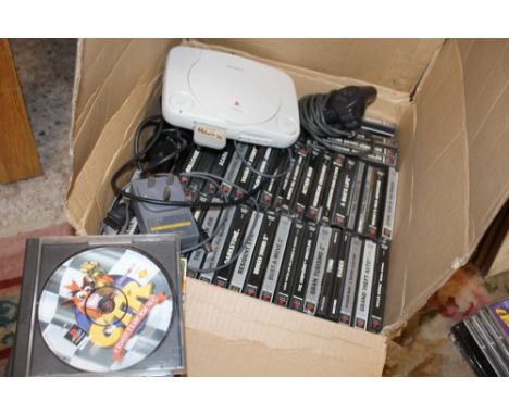 A PS ONE PLAYSTATION CONSOLE WITH GAMES AND CONTROLLERS 