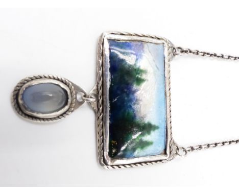 AN ARTS AND CRAFT STYLE ENAMELLED PENDANT. THE CENTRAL RECTANGLE ENAMEL IS A MOUNTAIN LANDSCAPE SCENE WITH A MOONSTONE DROPPE