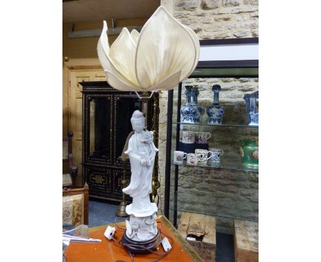 A CHINESE BLANC DE CHINE STANDING FIGURE OF A DEITY FITTED AS A LAMP WITH PETAL FORM SILK SHADE.   H.OVERALL 90cms.
