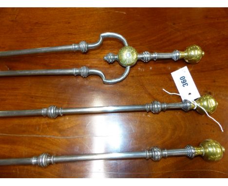 A GOOD RARE SET OF GEORGIAN STEEL AND BRASS MOUNTED FIRESIDE TOOLS WITH SHAPED HANDLES AND BRASS KNOP FINIALS.   POKER L.74cm