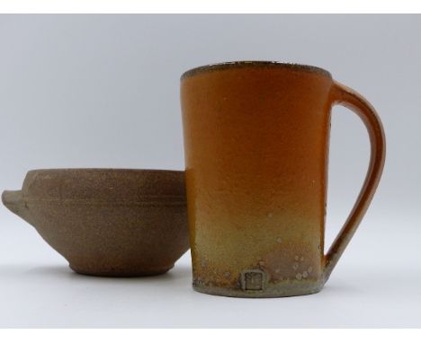 A STONEWARE POTTERY MUG AND TWO HANDLED POTTERY BOWL BY DAVID LEACH.   10cms. HIGH AND 11.5cms. DIAMETER RESPECTIVELY. (2)