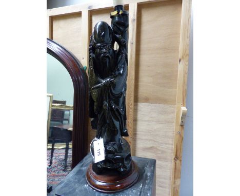 A CHINESE CARVED FIGURE OF A STANDING SAGE WITH WIREWORK INLAY MOUNTED AS A LAMP.   H.OVERALL 63cms.