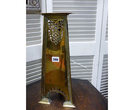 AN INTERESTING ARTS AND CRAFTS BRASS CANDLESTICK OF TAPERED TRIANGULAR FORM.