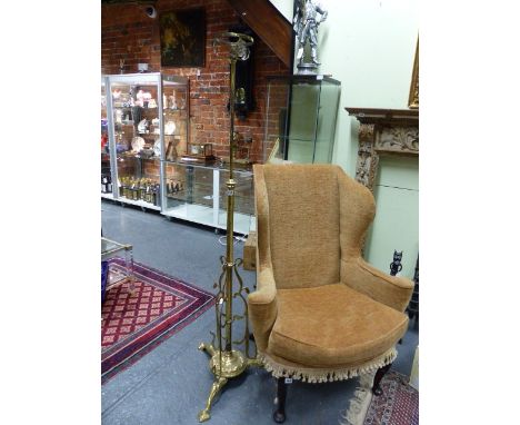 AN ANTIQUE ARTS AND CRAFTS BRASS HEIGHT ADJUSTABLE STANDARD LAMP.